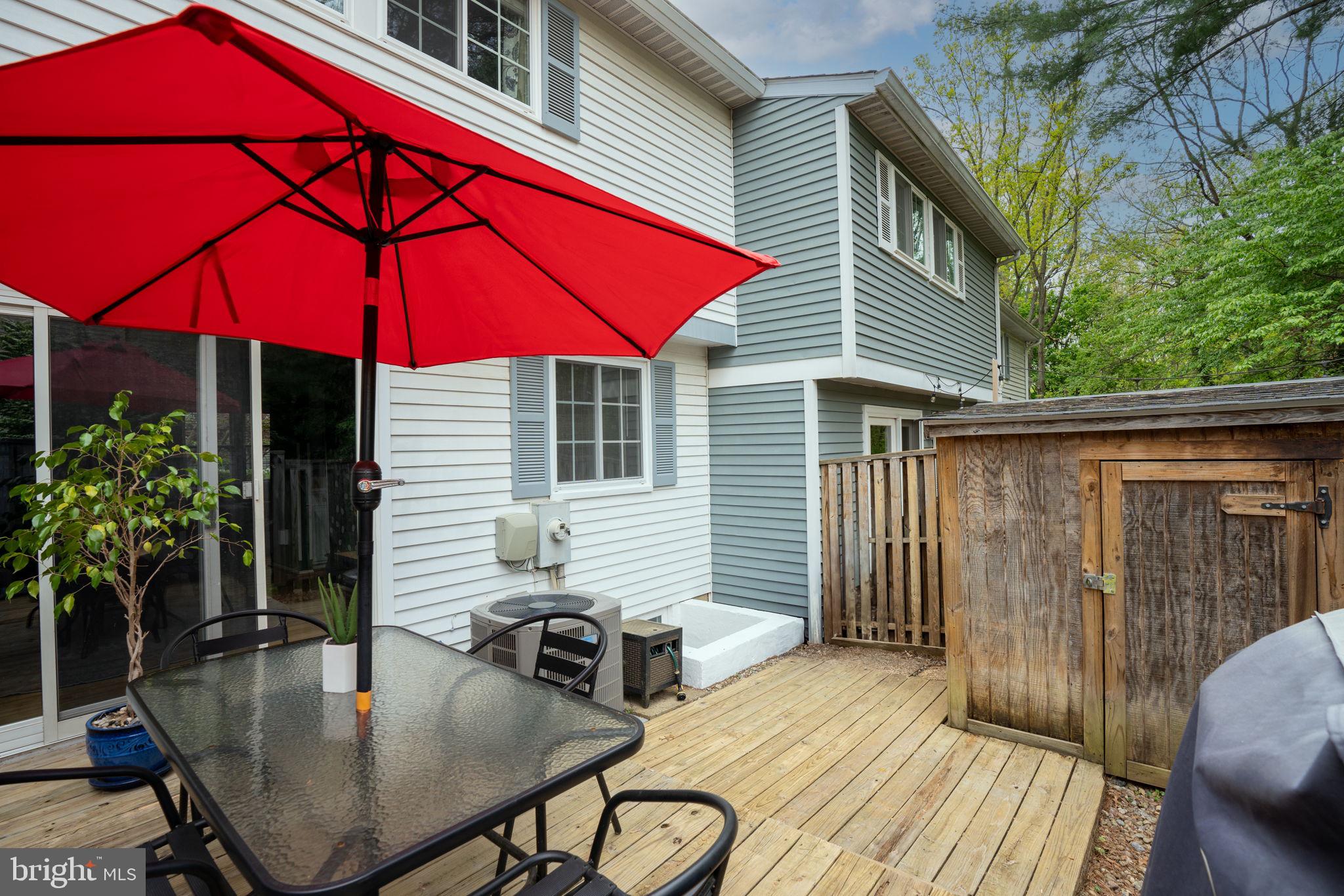 11537 Ivy Bush Court Reston, VA 20191 - Photo 39 of 49 a backyard of a house with table and chairs