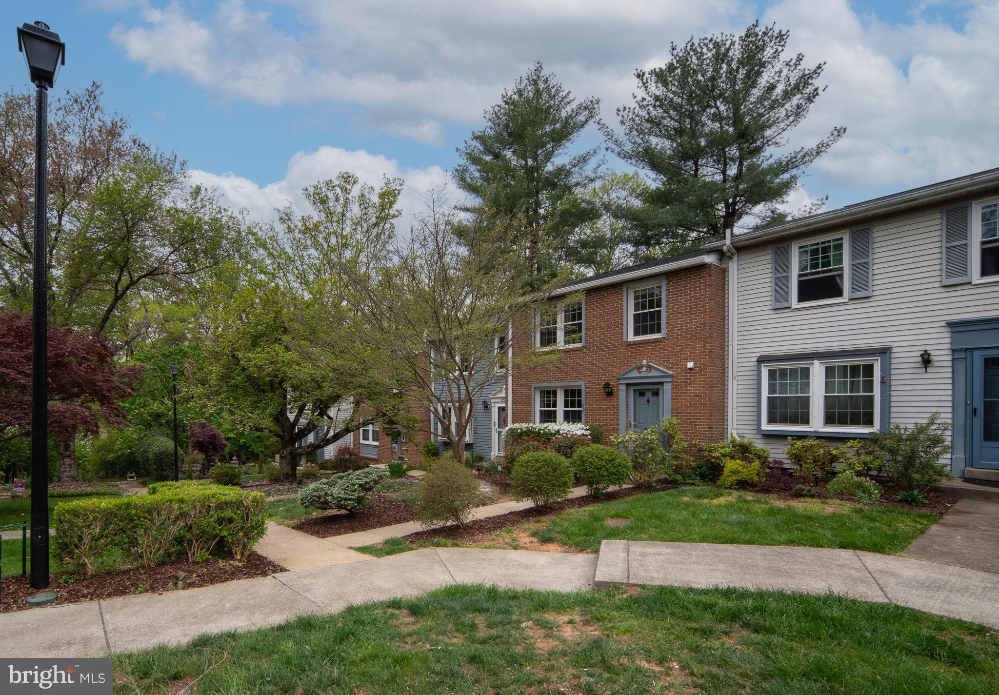 11537 Ivy Bush Court Reston, VA 20191 - Photo 4 of 49 a front view of a house with a yard and trees