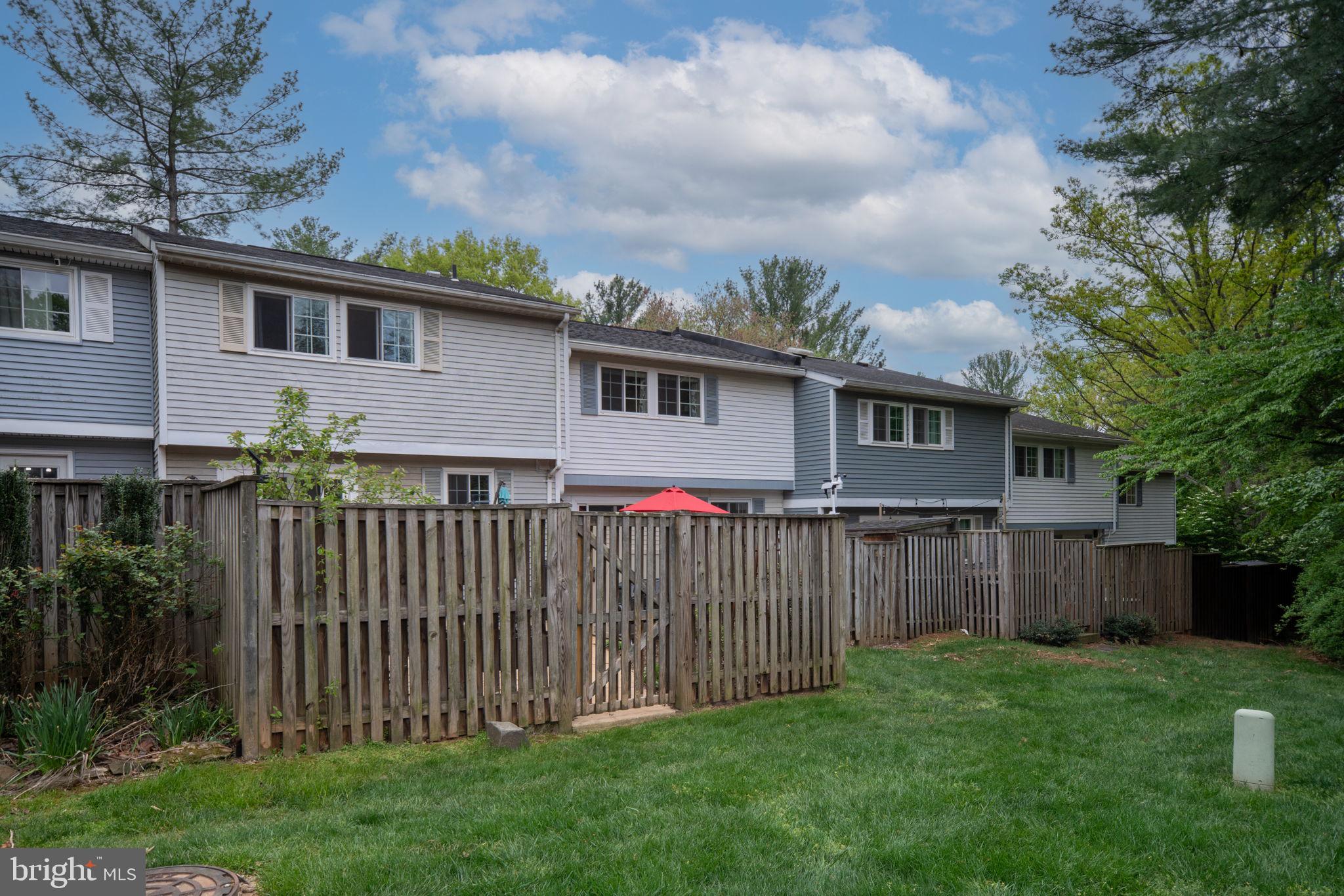 11537 Ivy Bush Court Reston, VA 20191 - Photo 42 of 49 a front view of house with yard and green space