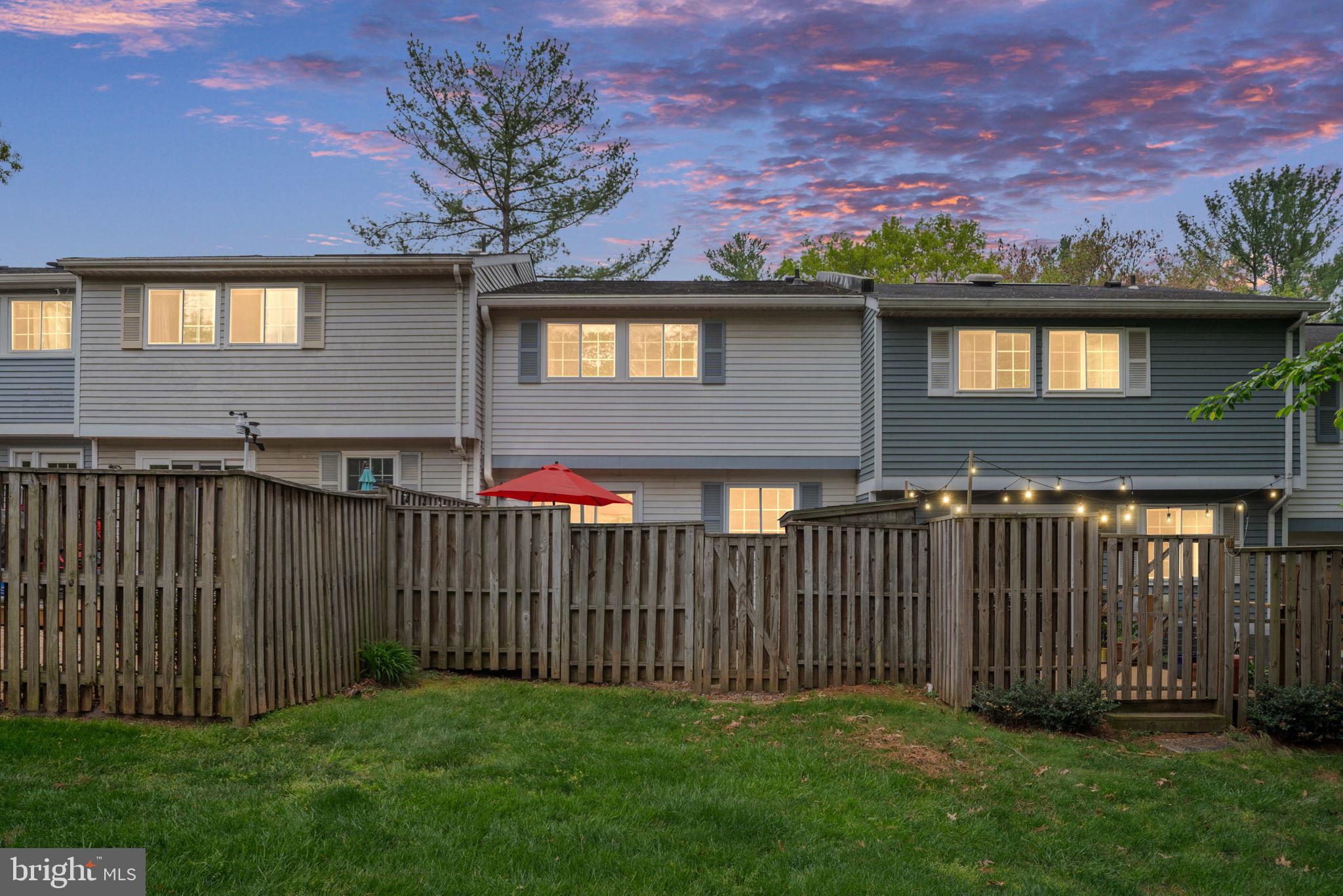11537 Ivy Bush Court Reston, VA 20191 - Photo 43 of 49 a front view of a house with a garden and yard