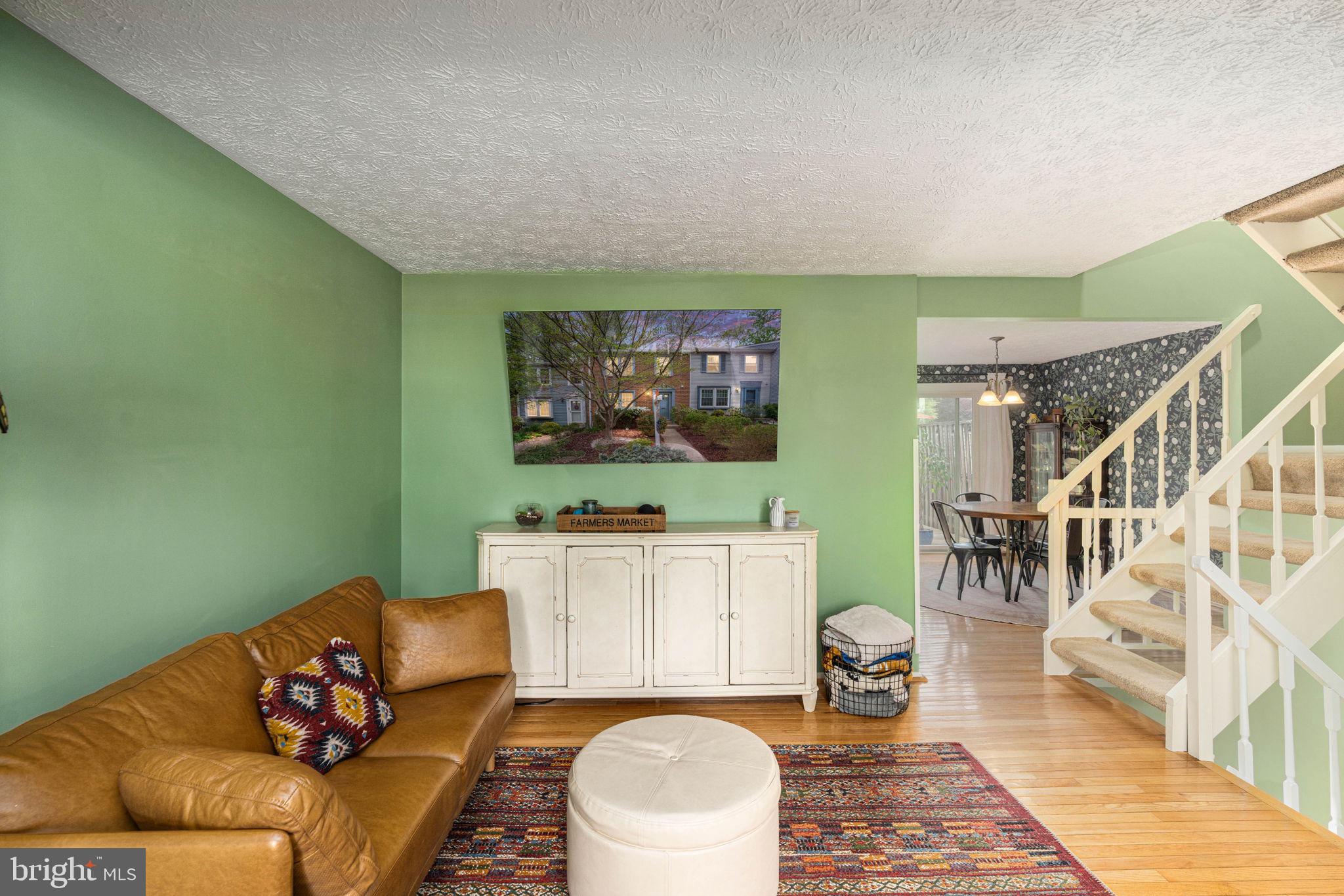 11537 Ivy Bush Court Reston, VA 20191 - Photo 8 of 49 a living room with furniture and a flat screen tv