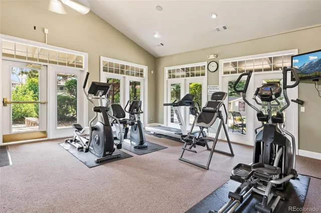 a view of a house with pool and a yard