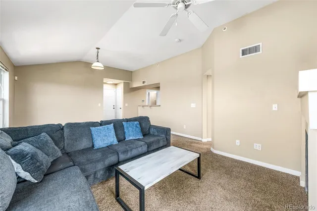 a living room with furniture and a couch