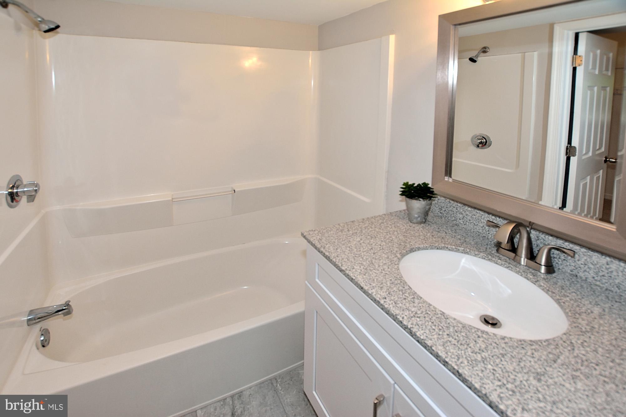 8353 Dunham Court, Unit 643 Springfield, VA 22152 - Photo 14 of 23 tub and vanity combination