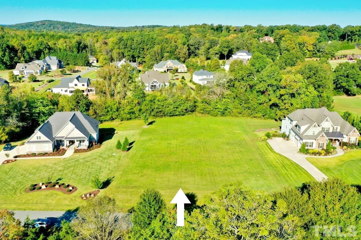 126 Harvest Lane Pittsboro, NC 27312 - Photo 2 of 2 a view of a swimming pool with a yard