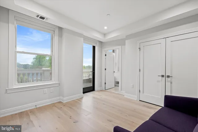 a view of an empty room with a window