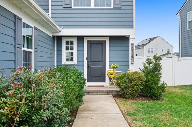 a front view of a house with garden