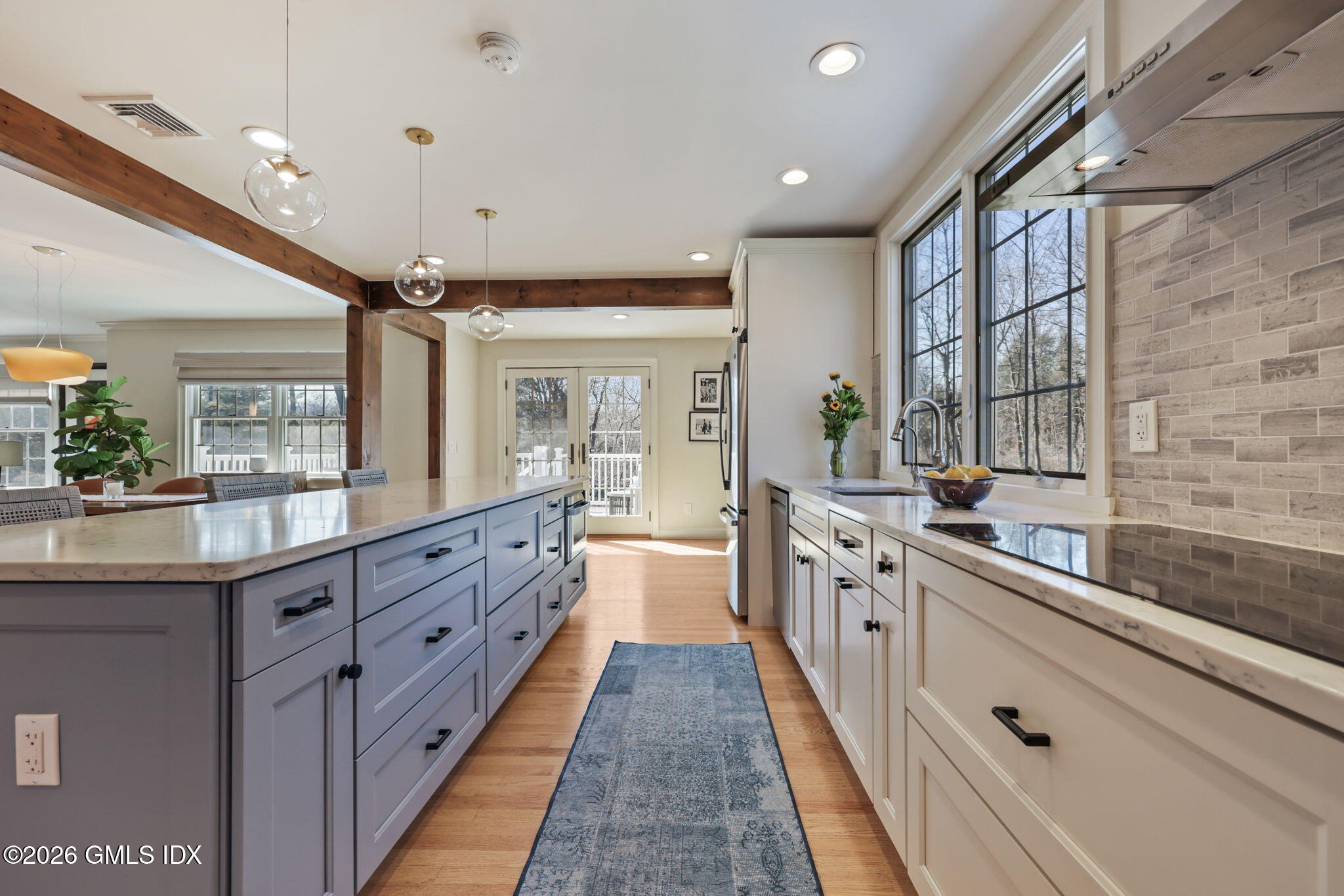 97 Davenport Ridge Lane Stamford, CT 06903 - Photo 12 of 31 a large kitchen with stainless steel appliances granite countertop a lot of counter space and wooden floors