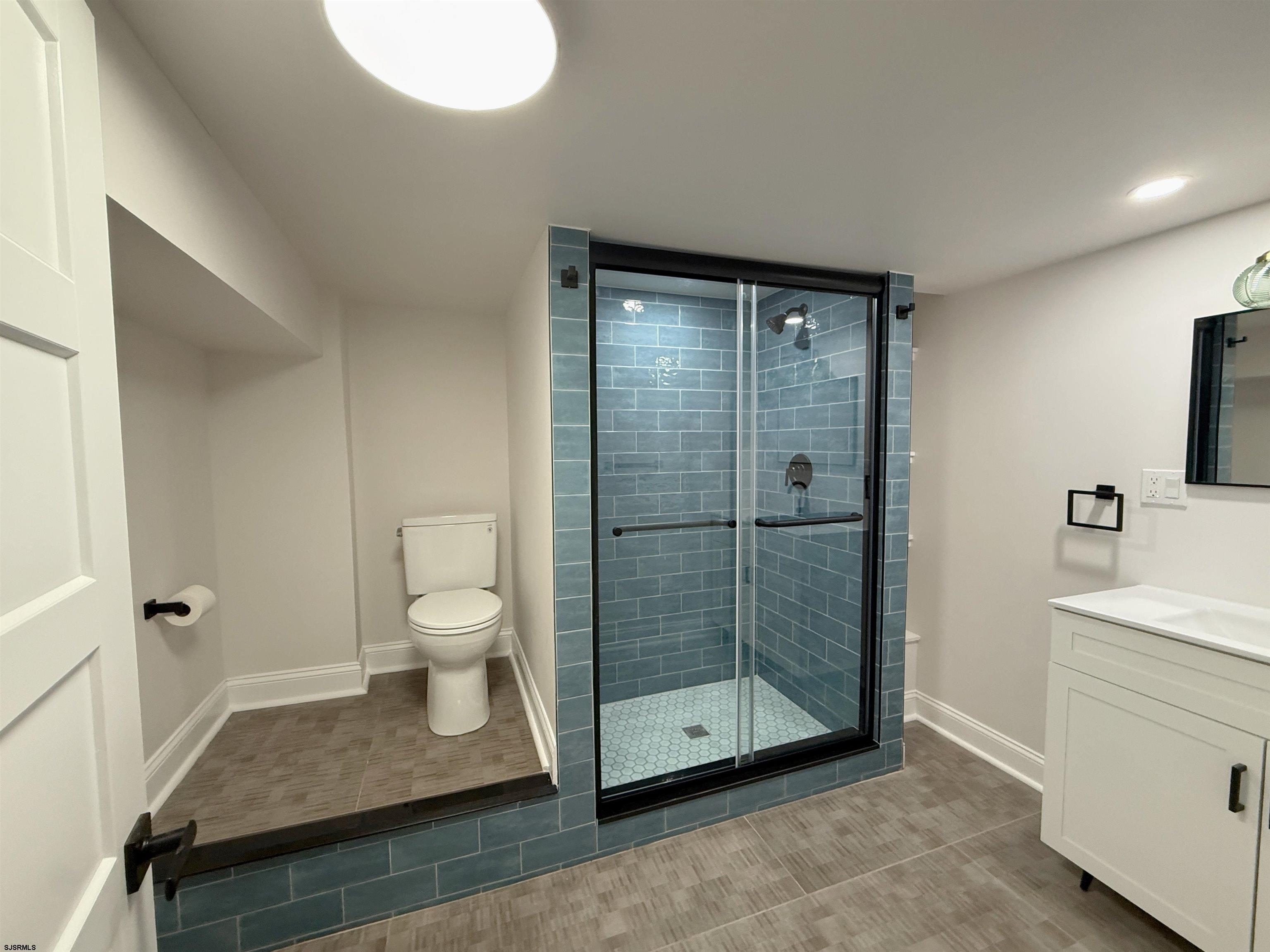 102 South Raleigh Avenue, Unit B Atlantic City, NJ 08401 - Photo 13 of 18 a bathroom with a shower toilet and sink