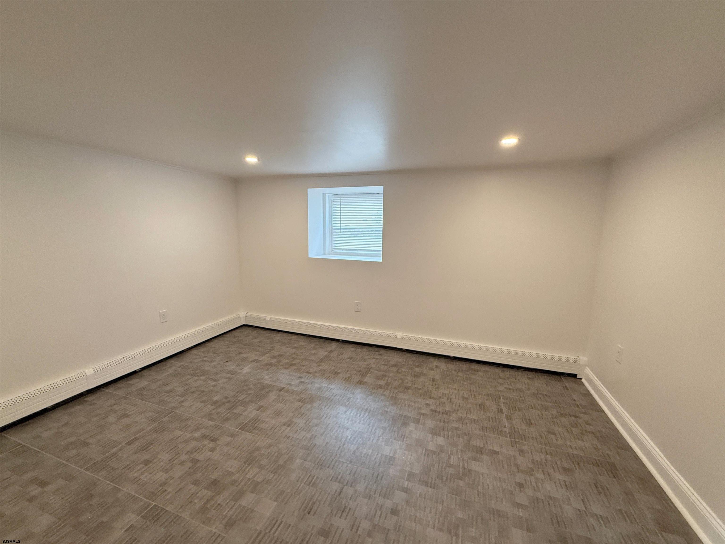 102 South Raleigh Avenue, Unit B Atlantic City, NJ 08401 - Photo 15 of 18 an empty room with a window