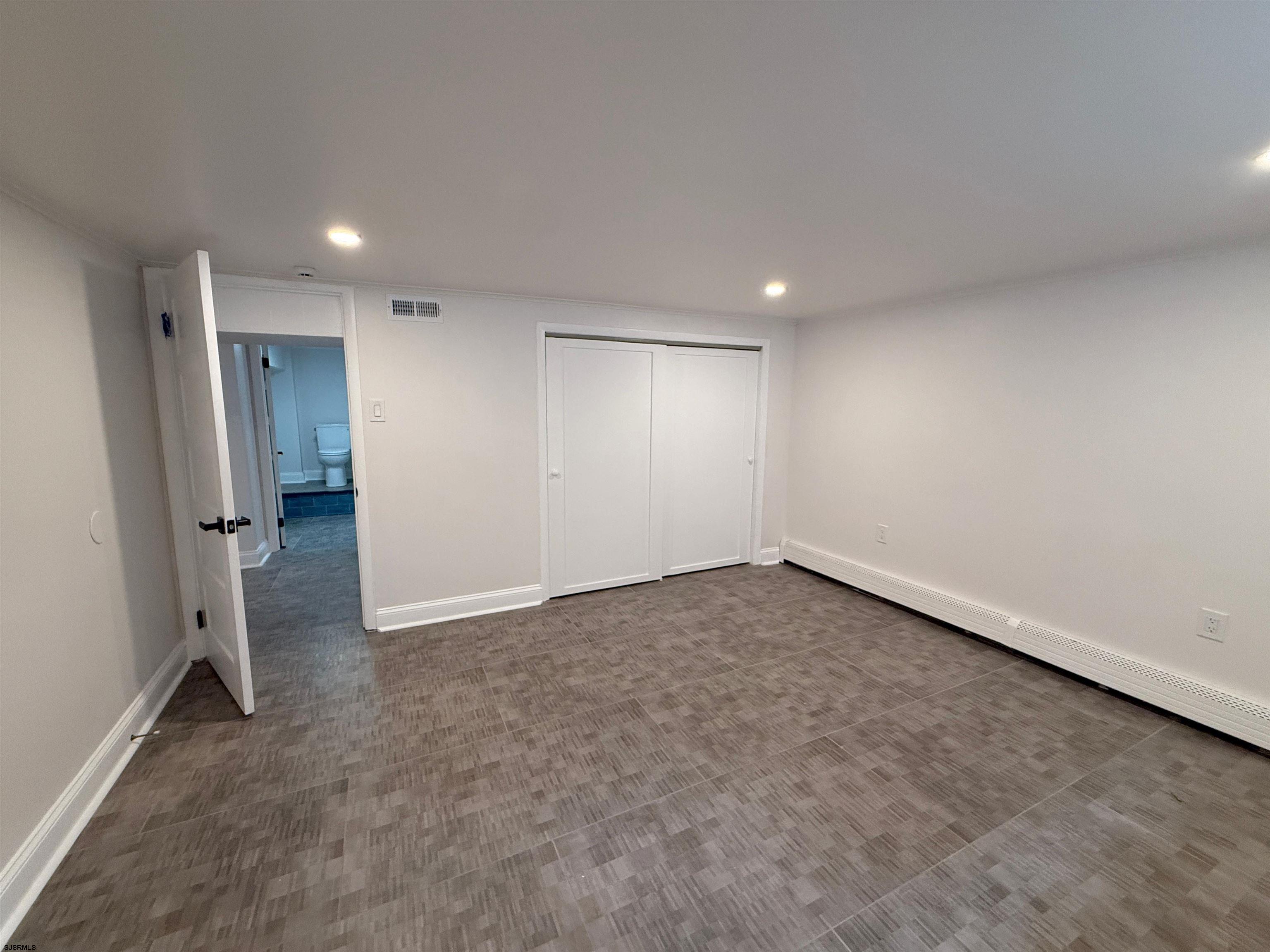 102 South Raleigh Avenue, Unit B Atlantic City, NJ 08401 - Photo 16 of 18 an empty room with a natural light