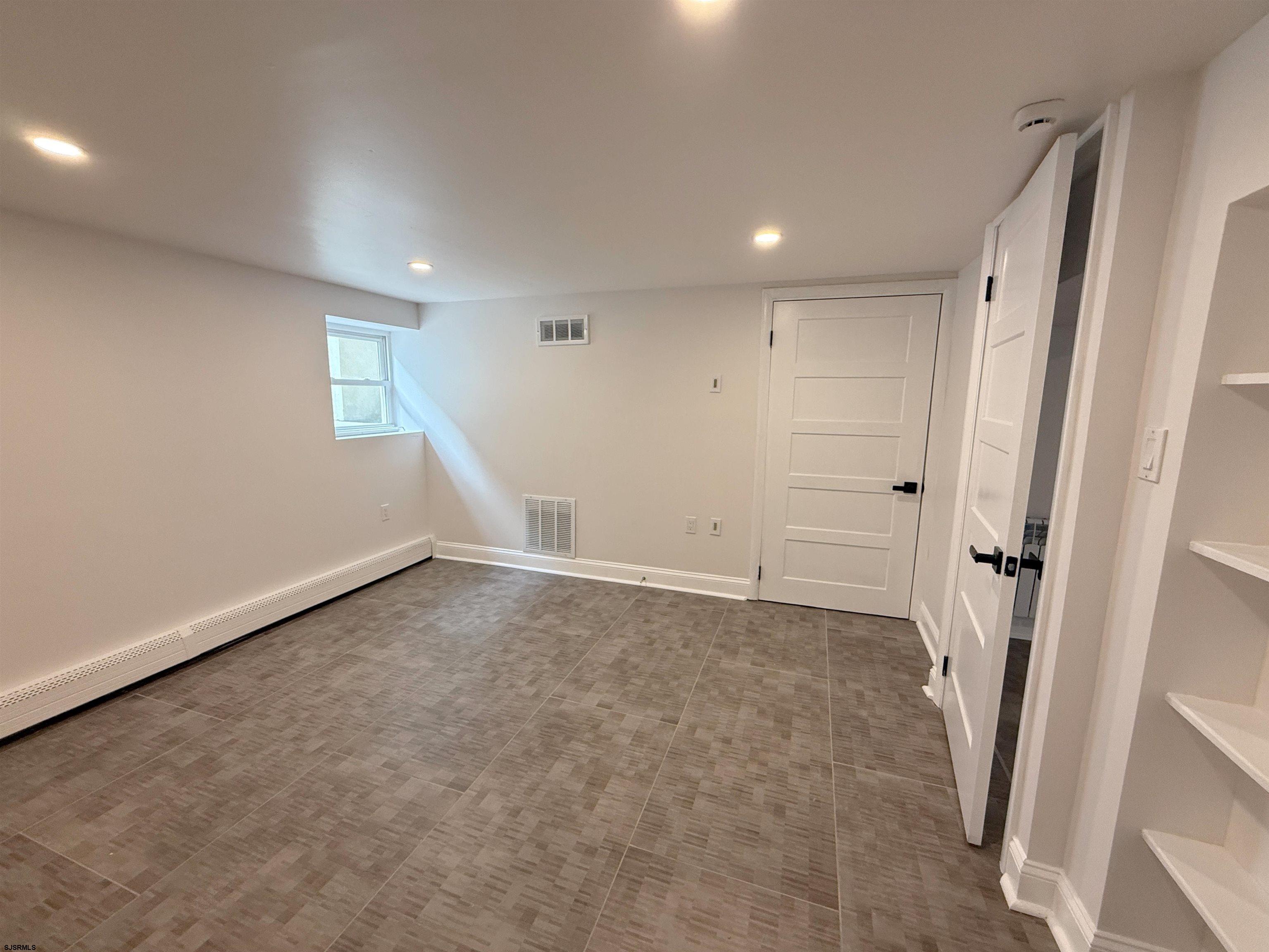 102 South Raleigh Avenue, Unit B Atlantic City, NJ 08401 - Photo 9 of 18 an empty room with a natural light