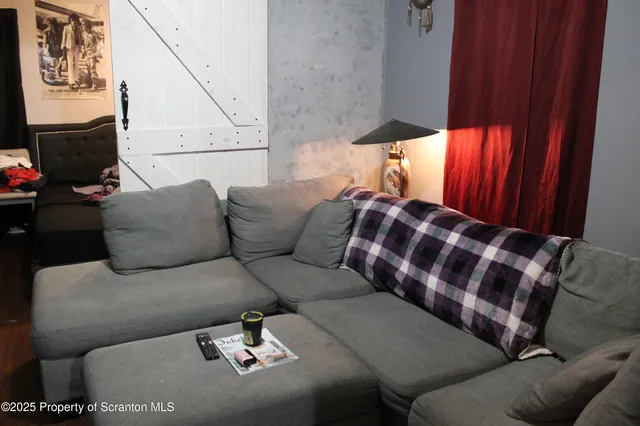 a living room with furniture and decor