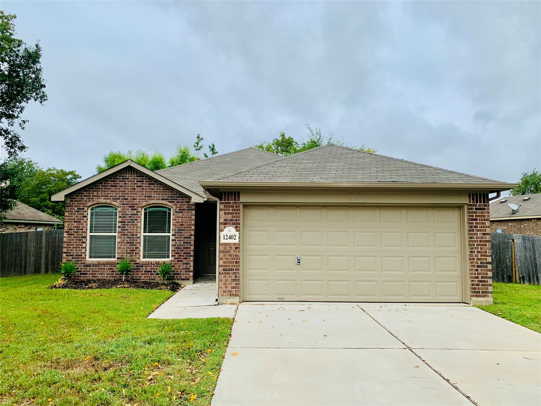 12402 Ridgecrest Drive Willis, TX 77318 - Photo 1 of 11 a view of a house with a yard