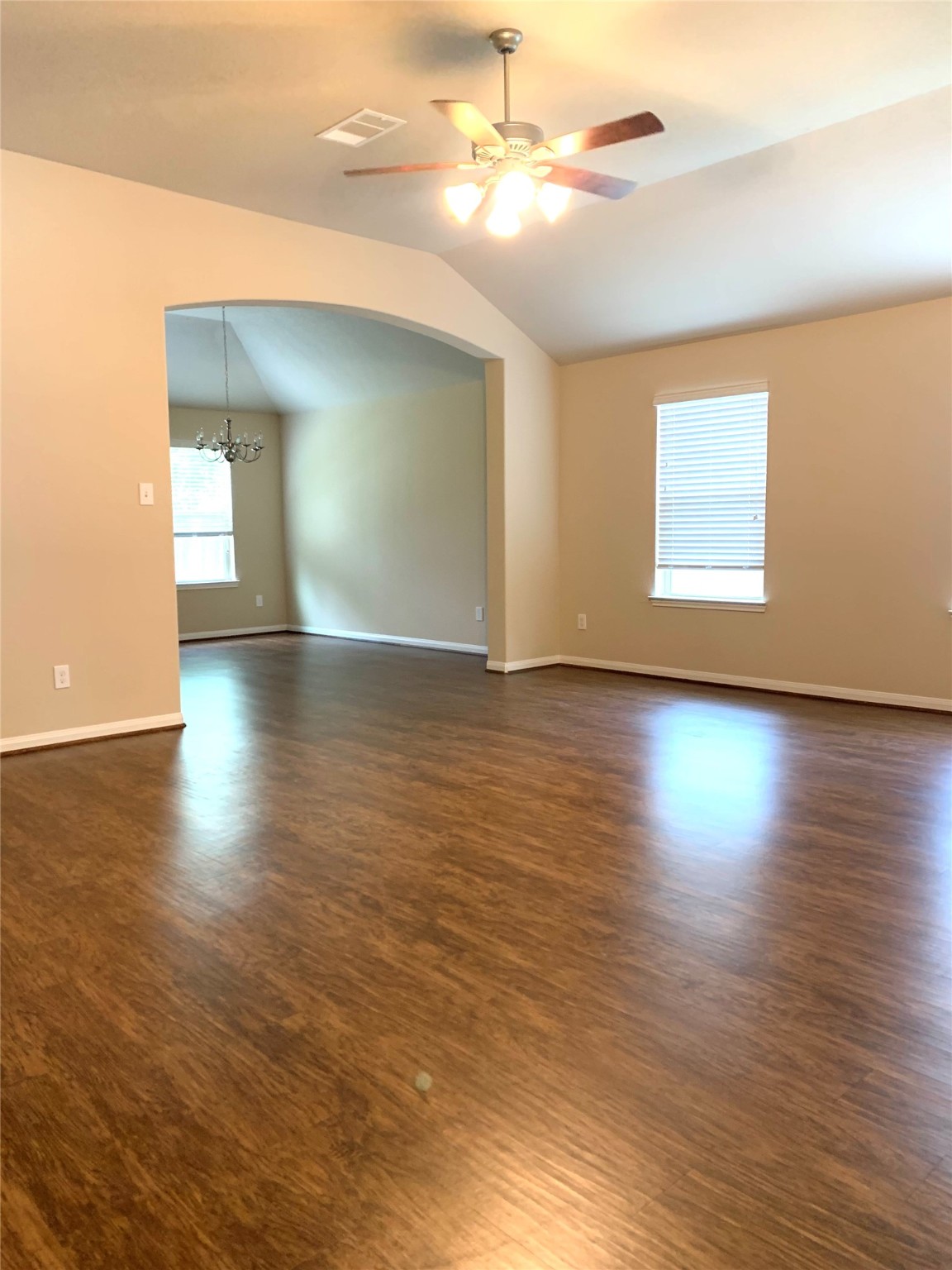 12402 Ridgecrest Drive Willis, TX 77318 - Photo 4 of 11 a view of empty room with wooden floor and fan