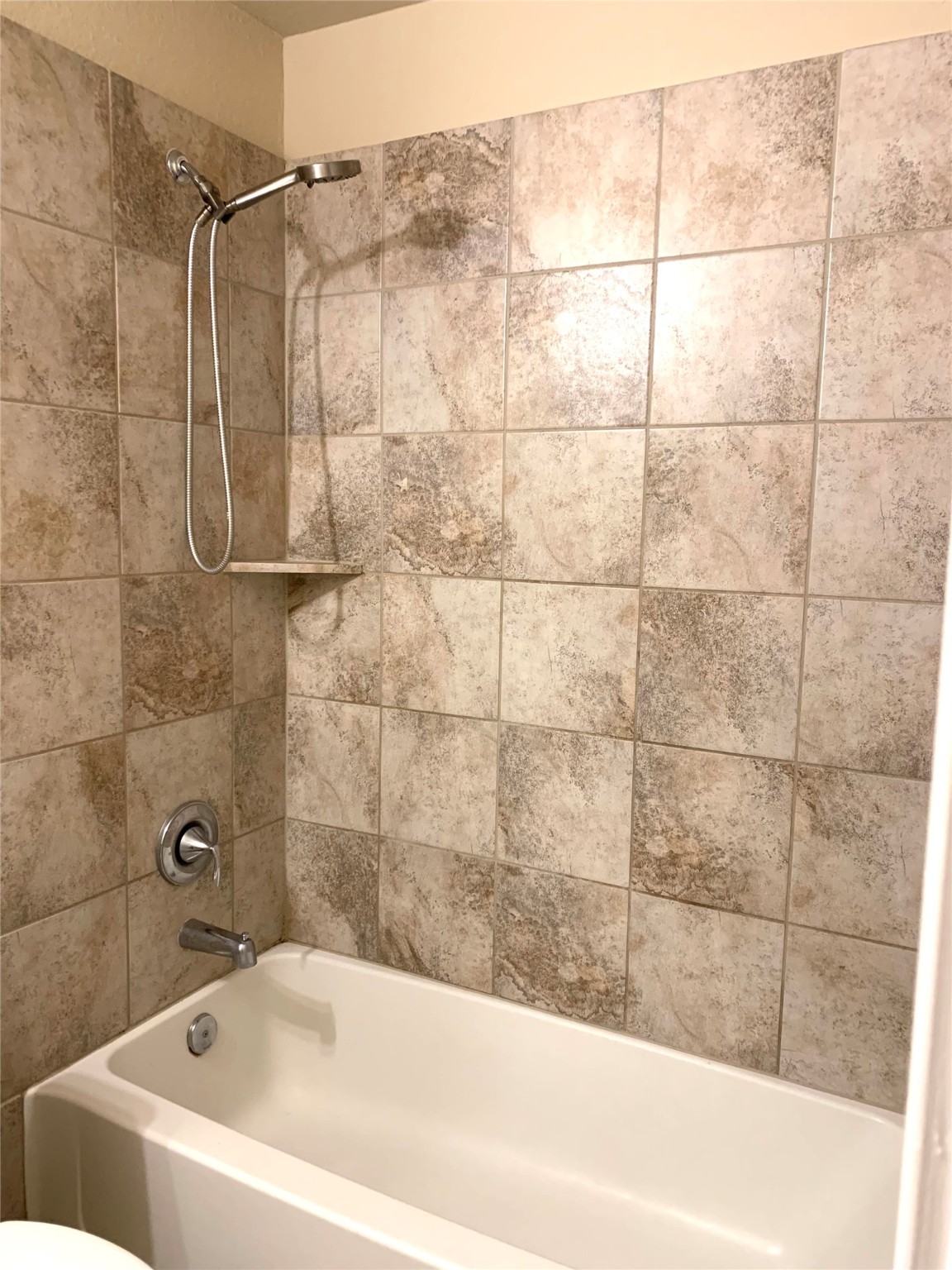 12402 Ridgecrest Drive Willis, TX 77318 - Photo 7 of 11 a bathroom with a bathtub and shower