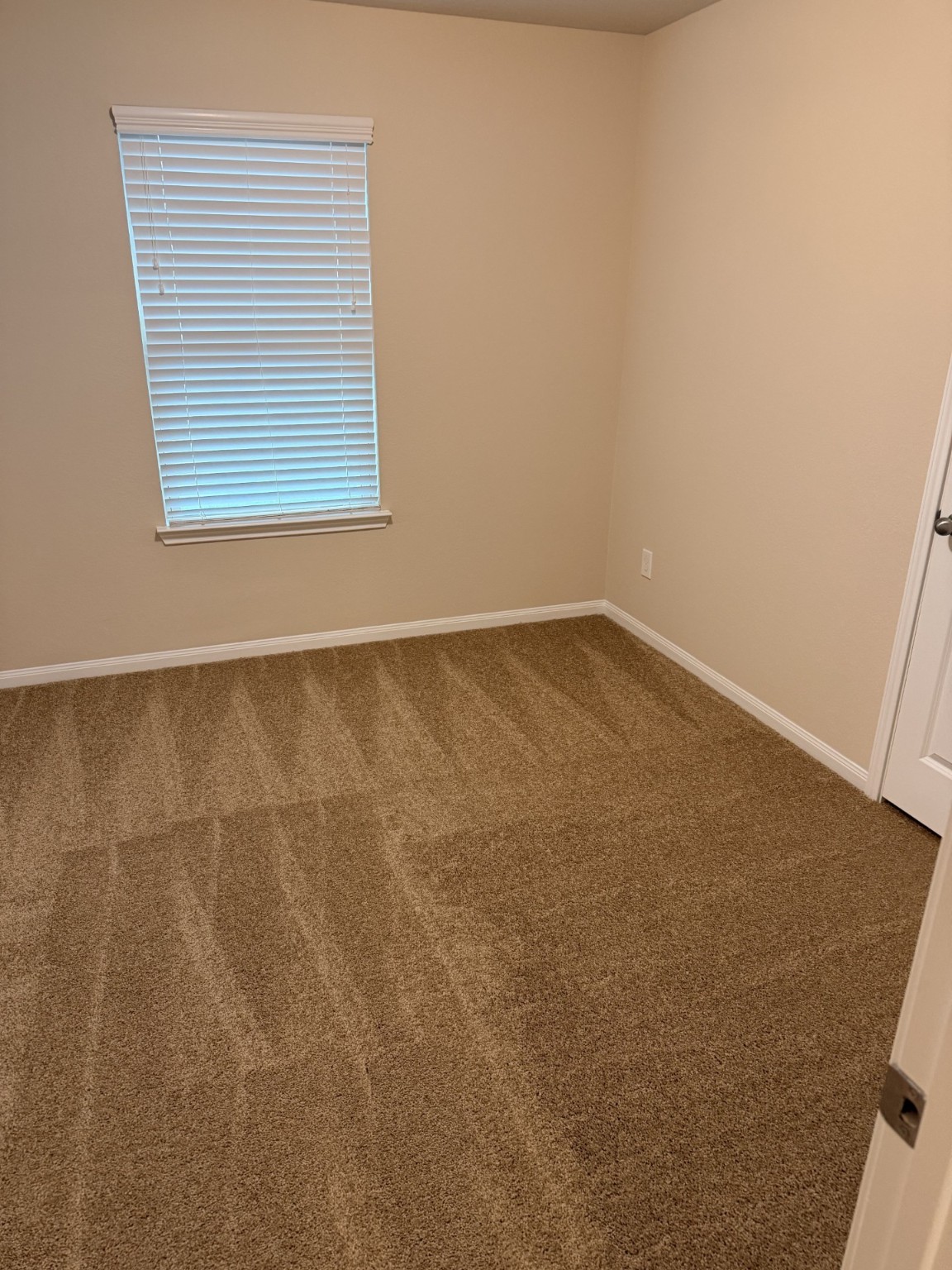 12402 Ridgecrest Drive Willis, TX 77318 - Photo 10 of 11 an empty room with a window