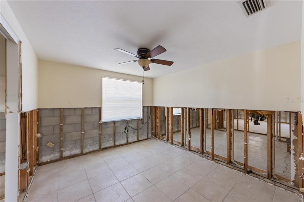 411 Alamanda Road Anna Maria, FL 34216 - Photo 13 of 41 a view of entryway and hall with a cabinet