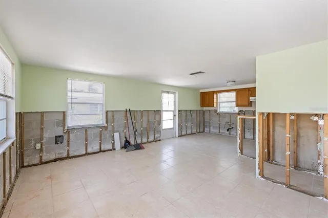 a view of a livingroom with furniture and windows