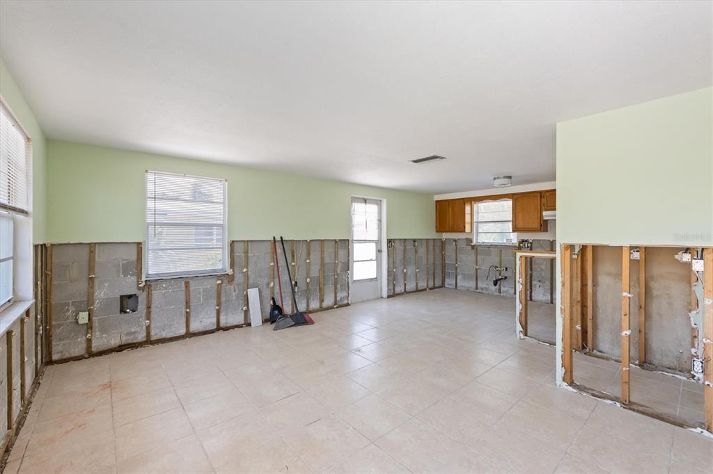 411 Alamanda Road Anna Maria, FL 34216 - Photo 20 of 41 a view of a livingroom with furniture and windows