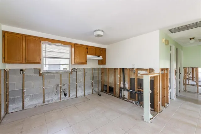 a view of a kitchen with refrigerator