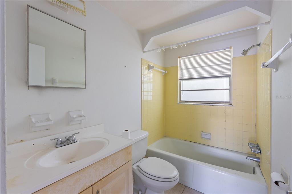 411 Alamanda Road Anna Maria, FL 34216 - Photo 23 of 41 a bathroom with a sink toilet and shower