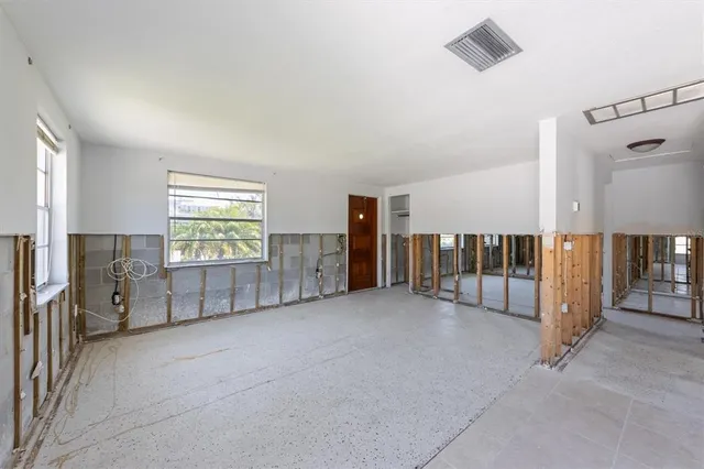 a view of a livingroom with entryway and furniture