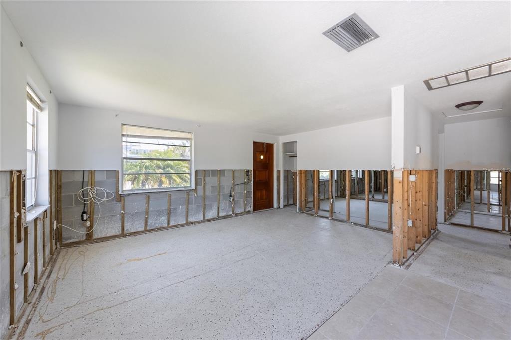 411 Alamanda Road Anna Maria, FL 34216 - Photo 28 of 41 a view of a livingroom with entryway and furniture