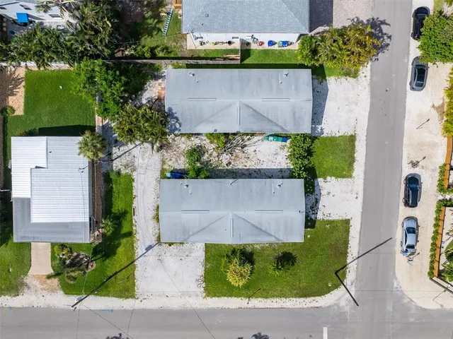 an aerial view of residential houses with outdoor space