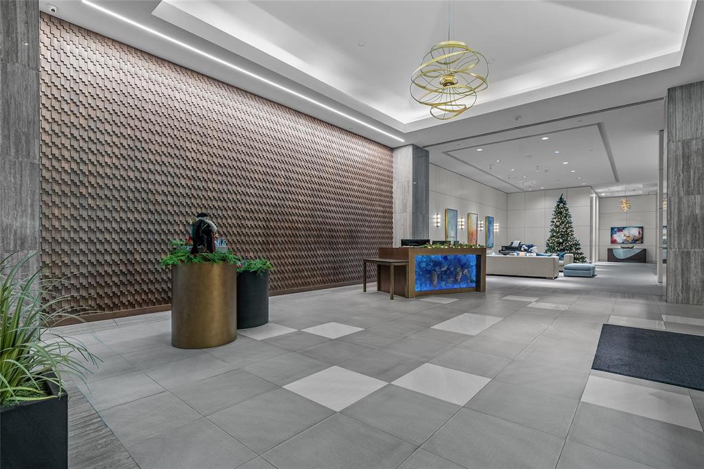 3111 Welborn Street, Unit 1701 Dallas, TX 75219 - Photo 19 of 33 a view of a living room and kitchen