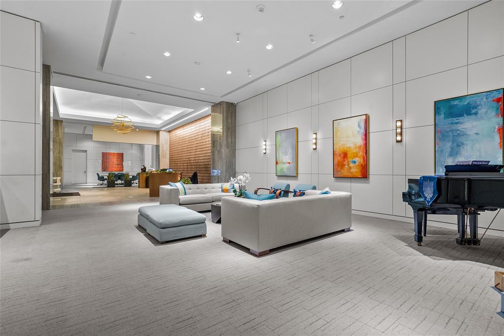 3111 Welborn Street, Unit 1701 Dallas, TX 75219 - Photo 20 of 33 a living room with fireplace furniture and a potted plant