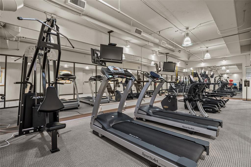 3111 Welborn Street, Unit 1701 Dallas, TX 75219 - Photo 24 of 33 a view of a room with gym equipment