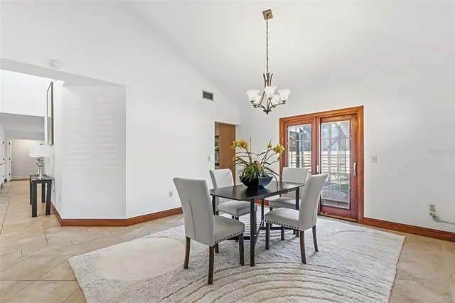 a kitchen with stainless steel appliances granite countertop a sink and a refrigerator