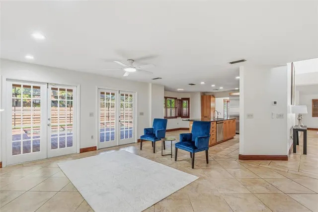 a spacious bathroom with a granite countertop tub sink and mirror