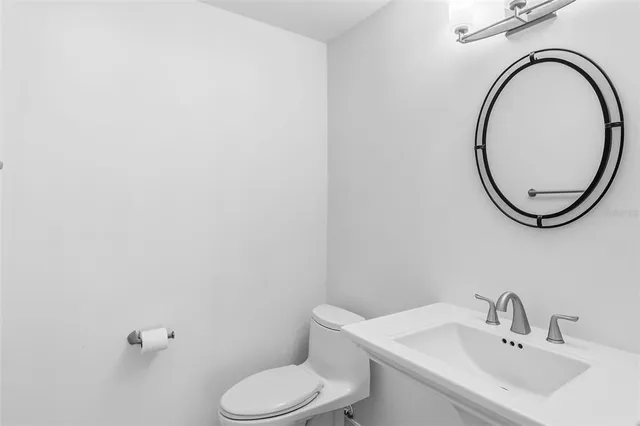 an empty room with a ceiling fan and a window