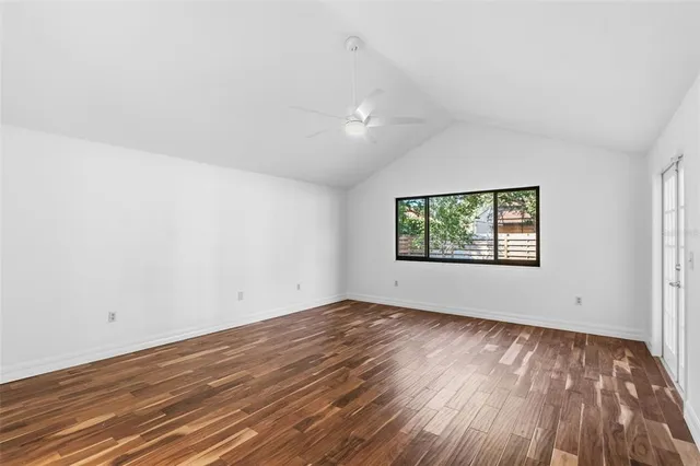 a view of a room with wooden floor