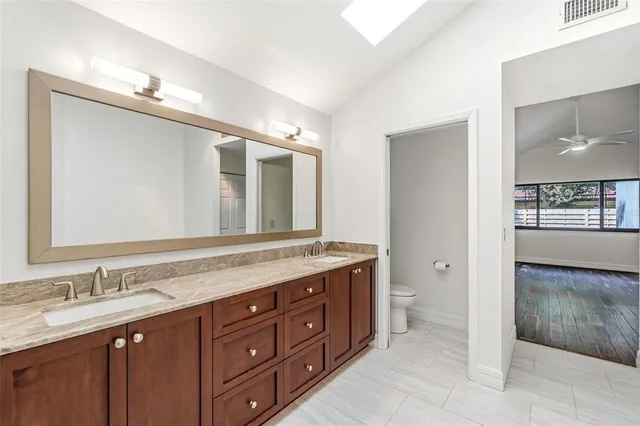 a view of a house with backyard porch and sitting area
