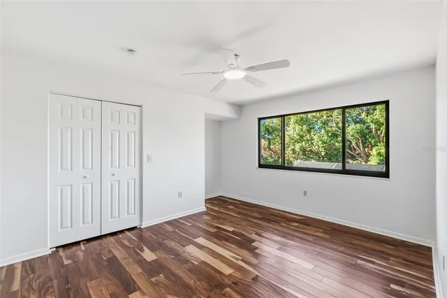 an aerial view of house with swimming pool and ocean view