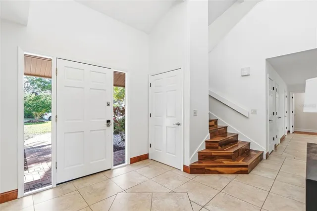 a bedroom with furniture and windows