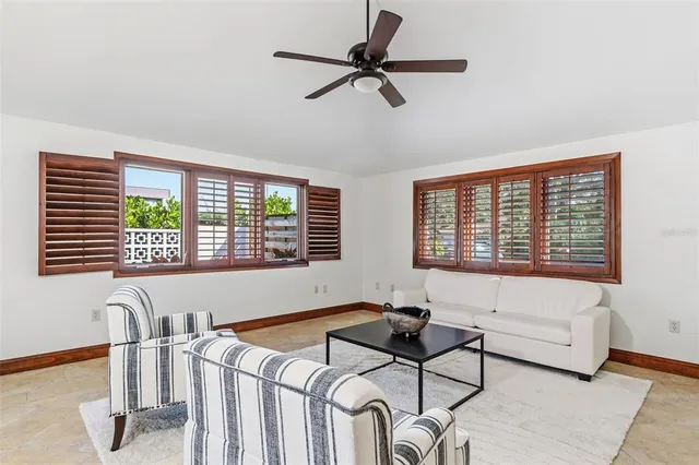 a dining room with furniture a rug and a chandelier