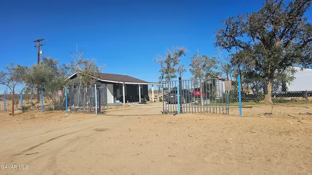 a view of a house with a snow on the road