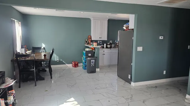 a room with furniture and a dining table