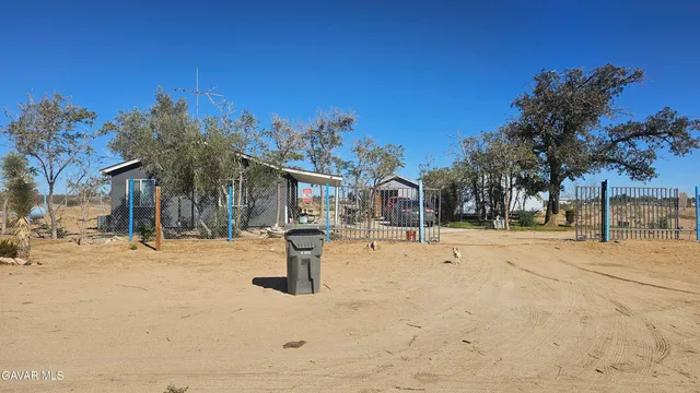 a street view with residential house and outdoor space