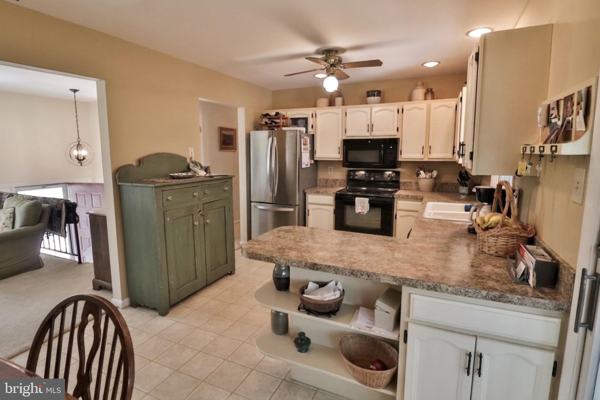 34 South Oak Street Lititz, PA 17543 - Photo 18 of 43 a kitchen with stainless steel appliances granite countertop a stove refrigerator and cabinets