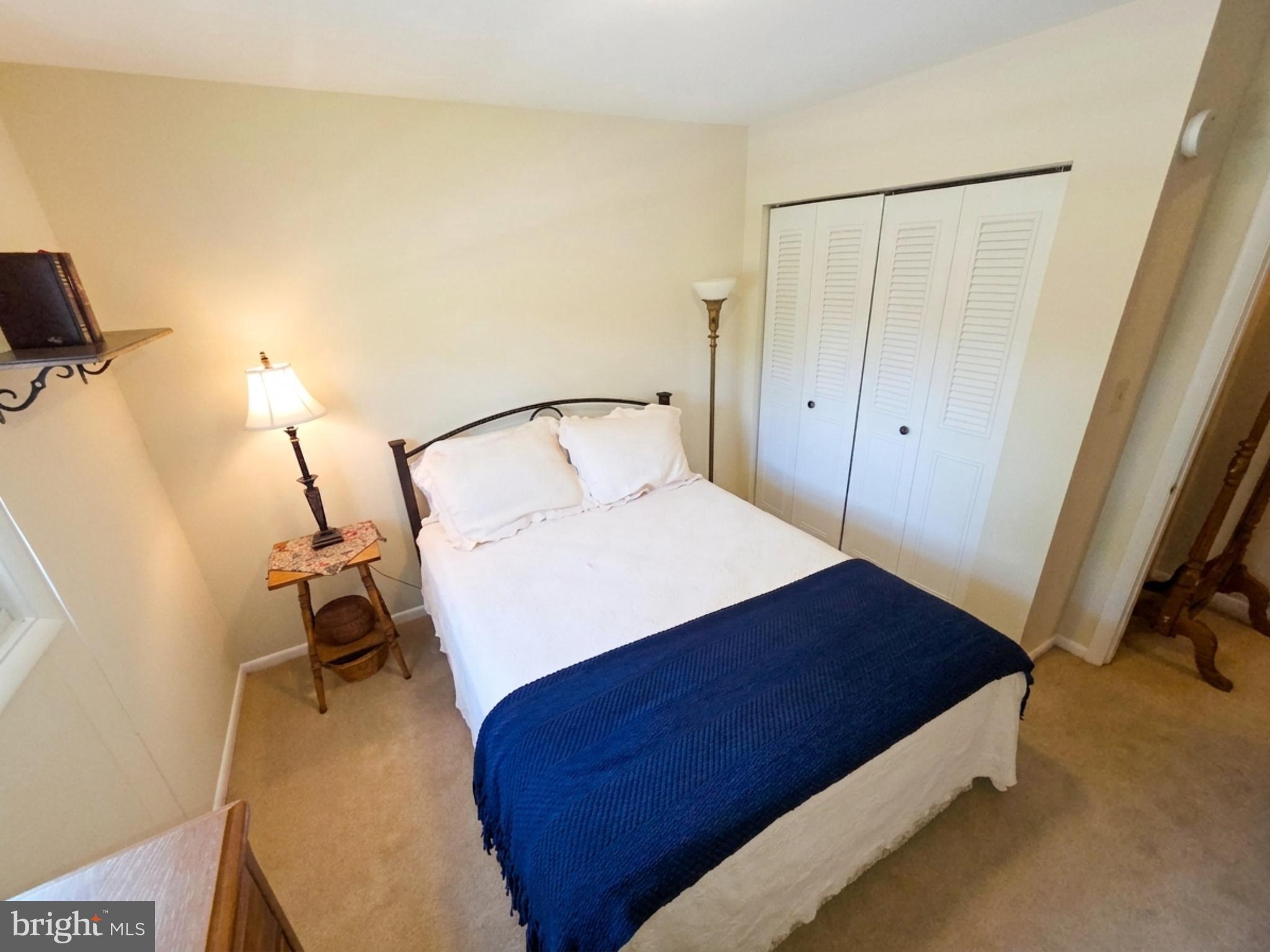 34 South Oak Street Lititz, PA 17543 - Photo 29 of 43 a bedroom with a bed and a flat tv screen on the dresser