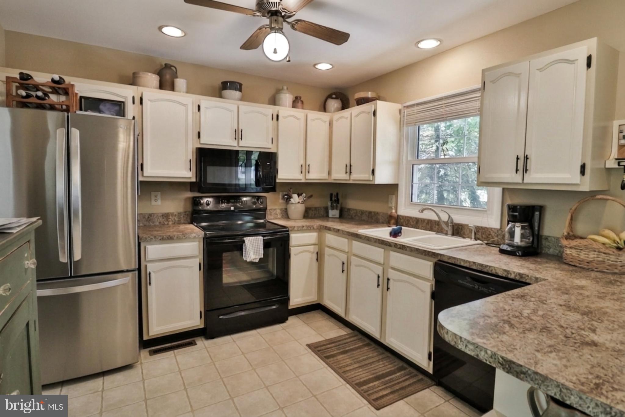 34 South Oak Street Lititz, PA 17543 - Photo 5 of 43 a kitchen with granite countertop a refrigerator oven a sink and cabinets