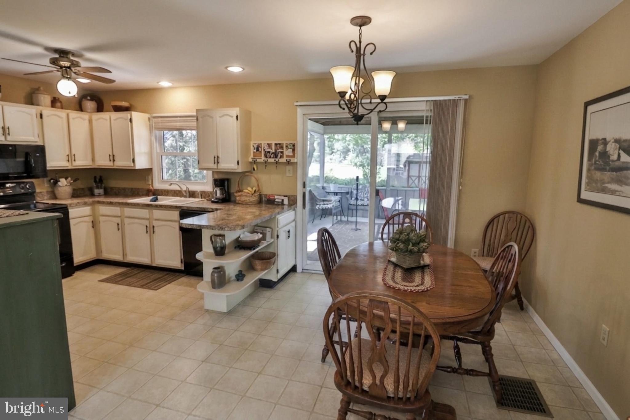 34 South Oak Street Lititz, PA 17543 - Photo 6 of 43 a view of a dining room with furniture a chandelier and wooden floor