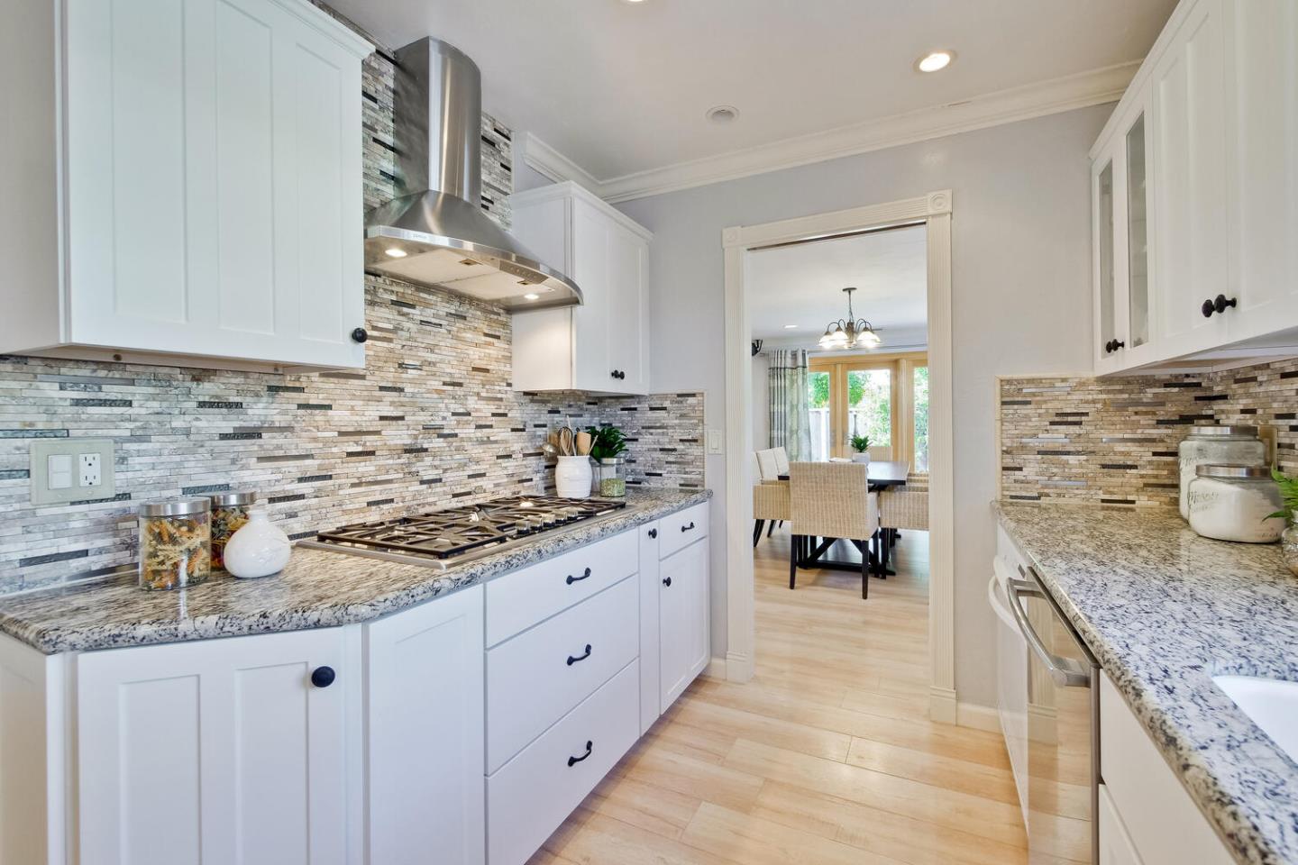 735 Widget Drive San Jose, CA 95117 - Photo 18 of 48 a kitchen with sink stove and cabinets