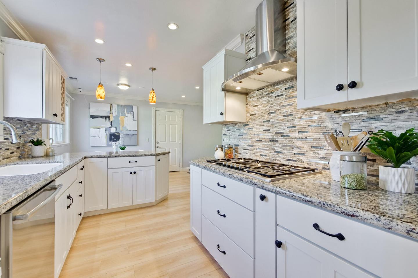 735 Widget Drive San Jose, CA 95117 - Photo 20 of 48 a kitchen with granite countertop a sink stainless steel appliances and white cabinets