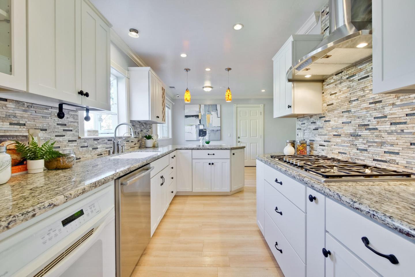 735 Widget Drive San Jose, CA 95117 - Photo 21 of 48 a large kitchen with stainless steel appliances granite countertop a stove a sink and a granite counter tops